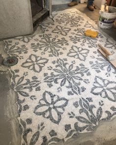 an area rug is being worked on in the bathroom