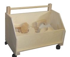 a wooden toy storage box with wheels and handles