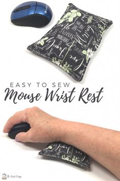 a hand holding a mouse next to a black and white pillow with the words easy to sew mouse wrist rest on it