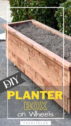 a wooden planter box filled with dirt