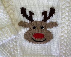 a knitted sweater with a reindeer's face on it