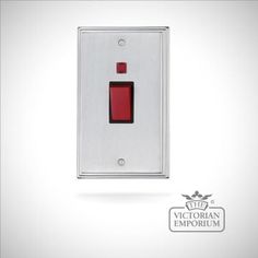 a red light switch on a white background with the words victoria emporum written below it