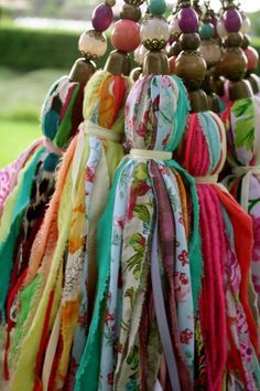 a bunch of ties that are hanging from a tree