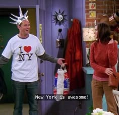 a man in a new york t - shirt is holding shopping bags and talking to a woman