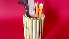 a pencil holder made out of bamboo sticks