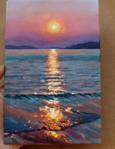 a painting of the sun setting over the ocean