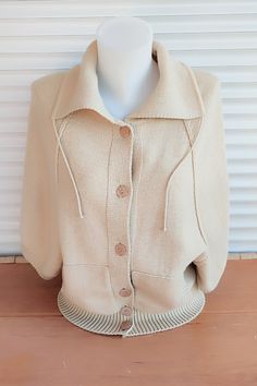 Vintage beige cardigan. Wool sweater .Pullover women's knitwear. Beige jacket with buttons, two pockets, high collar. Raglan sleeve 3/4 length. Back length - 20,47" or 52 cm. Distance from armhole to armhole -  18,89" or 48 cm. Good vintage condition. Care instructions: hand wash in cold water with mild soap, lay flat to dry.                                                                                                                                  Ready to ship. Beige Buttoned Sweater Coat With Long Sleeves, Beige Long Sleeve Sweater Coat With Button Closure, Beige Long Sleeve Sweater Coat With Buttons, Casual Beige Polo Sweater For Winter, Winter Beige Tops With Pockets, Casual Beige Winter Polo Sweater, Winter Cream Collared Tops, Oversized Beige Cardigan With Button Closure, Cozy Beige Polo Sweater For Fall