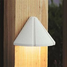 a light that is on the side of a wooden pole