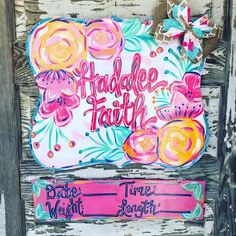 a painted sign that says, handle faith and time to laugh with flowers on it