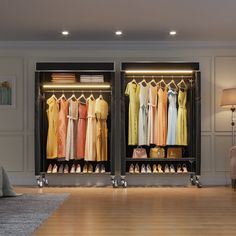 an open closet filled with lots of different colored dresses and shoes on hangers next to a lamp