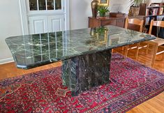 This Large 1970s Italian Green Verde Marble Stone Rectangular Pedestal Dining Table is a statement of timeless elegance. Crafted with meticulous attention to detail, the table boasts a stunning marble stone top.  Designed to be versatile, this rectangular table can effortlessly transition from a sophisticated dining table to an executive conference table, offering an impressive focal point in both settings.  VINTAGE ITEMS Our selection of vintage items exhibits subtle signs of wear, consistent w Green Marble Dining Room Table, Green Marble Table Dining, Green Marble Dining Table, Marble Table Dining, Green Granite Kitchen, Green Dining Table, Green Marble Coffee Table, Granite Kitchen Table, Green Marble Table