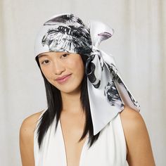 White/black floral-print satin headscarf. Headsize: 21.5"-23.5" / Tail length: 22" SKU: 25027-01324 Black Floral Print Scarf, Elegant Black Headscarf For Spring, Elegant Black Spring Headscarf, Black Silk Scarves With Floral Print, Black Silk Scarf With Floral Print, Elegant White Bandana For Spring, Chic Black Satin Silk Scarf, Trendy Black Headscarf For Spring, Elegant Black Bandana For Summer