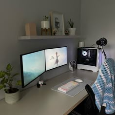 a computer desk with two monitors and a keyboard