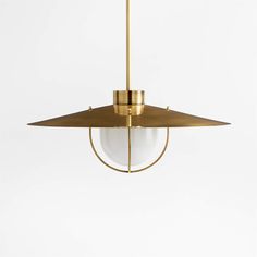 a brass pendant light hanging from the ceiling