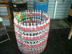 a large stack of bottles sitting on the ground