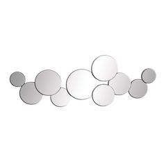 a wall mounted mirror with circles on it