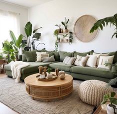 a living room filled with lots of green furniture