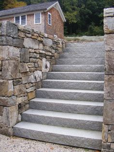 stone steps leading up to a house in the woods