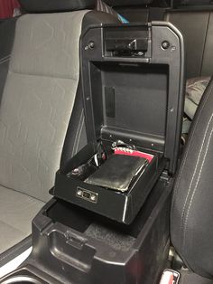 an open suitcase sitting in the back seat of a car