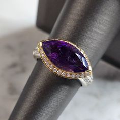 A Women's Vintage Estate 14k Yellow & White Gold Amethyst & Diamond Ring. The Ring Weighs 6.7g, And Is A Size 7.25. There Are About 0.44cts Of Diamonds. The Length Of The Ring Is 3/4". This Is A Lovely Gift For That Special Someone. Any Questions Please Dont Hesitate To Ask. Be Sure To Check Out Some Of My Other Great Items Up For Sale. Thank You. Luxury White Gold Amethyst Ring With Gemstone Accents, Luxury Purple Amethyst Ring With Halo Setting, Luxury Purple Gemstones With Halo Setting, Luxury White Gold Amethyst Ring With Diamond Accents, White Gold Amethyst Ring With Diamond And Gemstone Accents, Luxury Amethyst Ring With Diamond Accents For Anniversary, Luxury Amethyst Ring With Halo Setting, Elegant Purple Gemstones With Halo Setting, Luxury Amethyst Gemstones For Anniversary