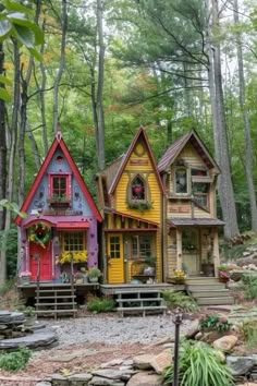 three colorful houses are in the woods