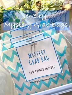 the mystery grab bag is packed with blue and white chevron paper, which are also in plastic bags