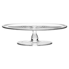 an empty glass cake plate on a white background