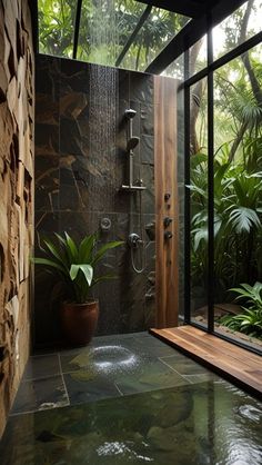 a bathroom with a large shower and plants in it