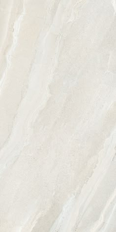 a white marble textured surface with some light brown spots