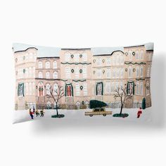 a decorative pillow with an image of buildings on it