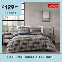 a bed with plaid comforter and pillows on it for $ 122 99 reg $ 156 00