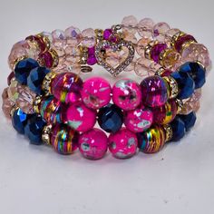 the bracelets are decorated with different colored beads and hearts on each one side,