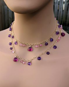 When you are in the mood to feel pretty, this long pink and purple necklace should do the trick. Smooth amethyst and kunzite hydro quartz hearts are wrapped with faceted pink topaz rondelles on figaro 8 chain. It measures 32" long and is finished with a hand made hook clasp. Wrapped in gold filled wire on gold filled chain. Pink Topaz Necklace, Ideas For Jewelry, Purple Necklace, Topaz Necklace, Pink Topaz, Wedding Jewellery Necklace, Wedding Necklaces, Hook Clasp, Make Jewelry