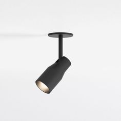 a black track light on a white background with the lights turned off and one arm down