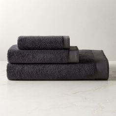 two black towels stacked on top of each other