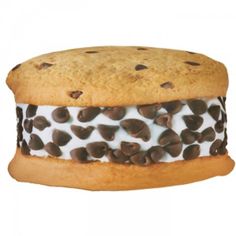 a chocolate chip cookie sandwich with white frosting and chocolate chips on it's side