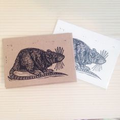 two coasters with drawings of mice on them