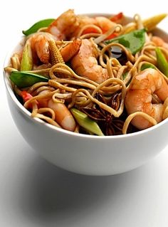 a white bowl filled with noodles and shrimp