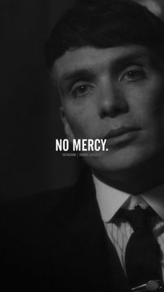 a man in a suit and tie with the words no mercy