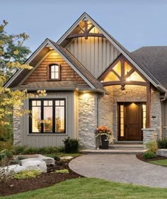 a house that is lit up with lights on the front door and windows in the back