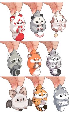 several different kinds of stuffed animals being held by someone's hand with their fingers