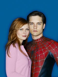 the amazing spider man and woman are posing together