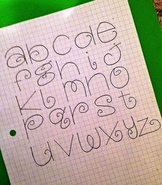 the letters and numbers are drawn on a piece of paper