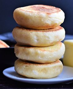 a stack of pancakes sitting on top of a white plate