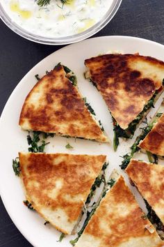 several slices of quesadilla on a white plate