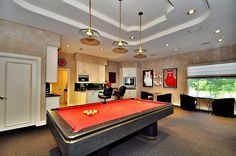 a pool table in the middle of a room