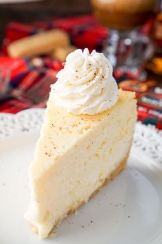 a slice of cheesecake with whipped cream on top