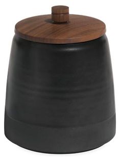 a black and brown container with a wooden lid