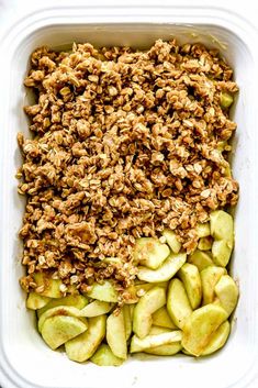 an apple and granola dish in a plastic container with the toppings on top