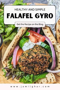 falafel gyro with lettuce, tomatoes and onions on the side